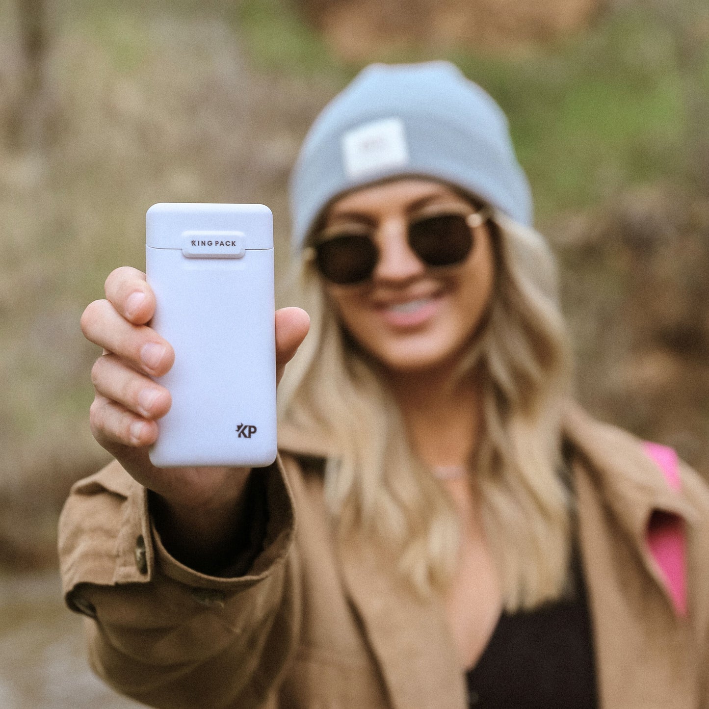 person displaying a matte white Kingpack case